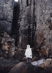 Fashion shooting in nature, a girl model in a fur coat made of artificial fur.