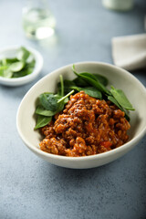 Homemade minced beef ragout with spinach