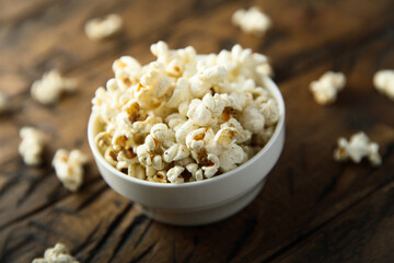 Homemade salted popcorn in a white bowl