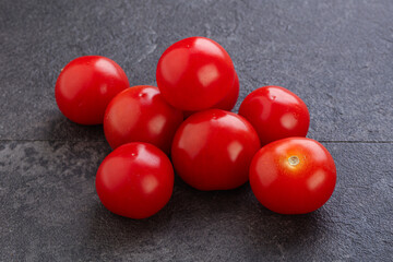 Ripe juicy cherry tomatoes heap