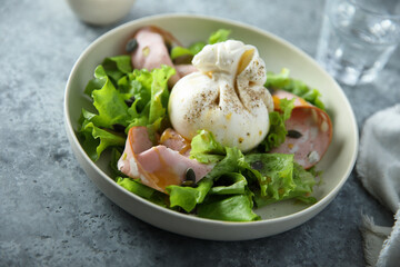 Green salad with mortadella and burrata cheese