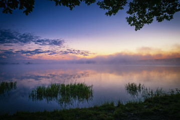 beautiful sunrise over the lake. Autumn sunrise over the Zemborzycki Reservoir. Reflections in the water. - obrazy, fototapety, plakaty