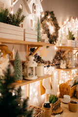 side view. Christmas decor. garlands on decorated in kitchen for new year. 