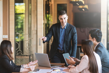 Group of young business people brainstorm collaboration ideas at the office.