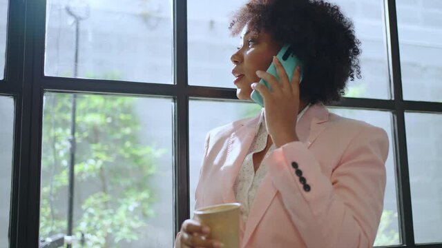 African Female enjoy call,online chat,internet purchase,browse web, download new freeware application.African woman calling on smart phone in application for business correspondence.