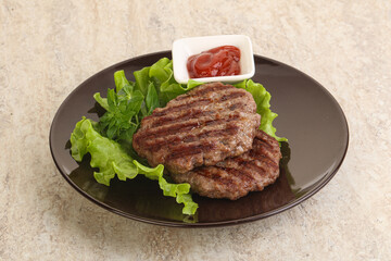 Grilled beef burger cutlet with sauce