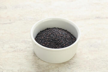 Fototapeta na wymiar Black sesame seeds in the bowl