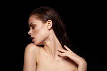 woman model bare shoulders clean skin wet hair dark background