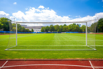 soccer goal on a green lawn on the field