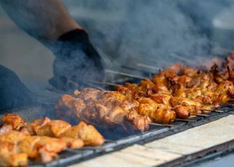 View of a barbecue roasting in a cloud of smoke