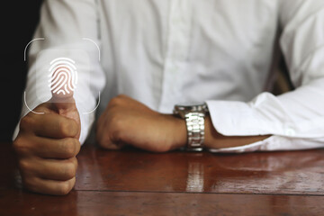 businessman scan fingerprint biometric identity and approval. concept of the future of security and password control through fingerprints in an immersive technology future and cybernetic.