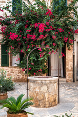 Old town with roses and sandstone walls