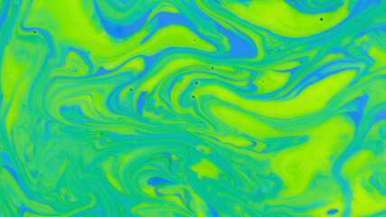 Attractive bright marble gradient, abstract background mixed yellow, green and blue nail polish,...