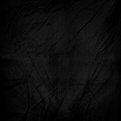 Black and crumpled fabric as a background motive