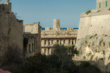 Fototapeta premium Old Medieval walled town by the sea over cliff in Malta, Valetta, Vittoriosa, Senglea and Cospicua, known as the Three Cities