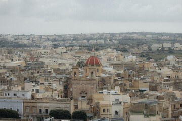 Fototapeta na wymiar Old town from hilltop with greenery in Malta, Gozo