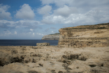 Coast with water and sky in late day on island of Malta, Gozo