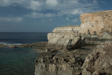 Coast with water and sky in late day on island of Malta, Gozo