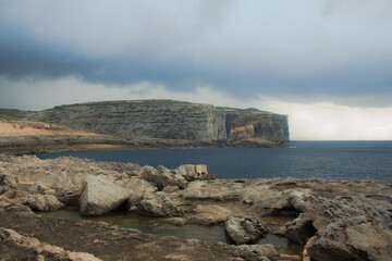Coast with water and sky in late day on island of Malta, Gozo
