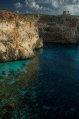 Coast with water and sky in late day on island of Malta, Gozo