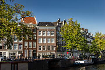 Street view with buildings and during day and canal in Amsterdam, Netherlands