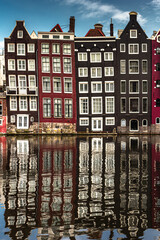 Fototapeta premium Street view with buildings and during day and canal in Amsterdam, Netherlands