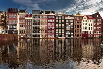 Naklejka premium Street view with buildings and during day and canal in Amsterdam, Netherlands