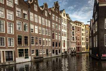 Obraz premium Street view with buildings and during day and canal in Amsterdam, Netherlands