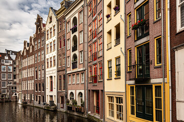 Fototapeta premium Street view with buildings and during day and canal in Amsterdam, Netherlands
