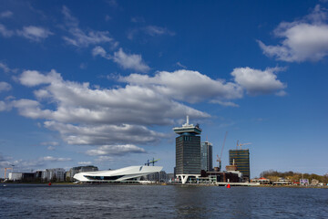 Fototapeta premium Buildings from waterfront during day in Amsterdam, Netherlands