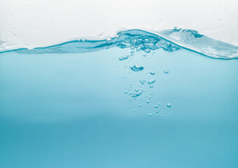 Water waves splash with air bubbles, isolated on the white background. abstract blue water waves on a white background. for a product, advertising,text space