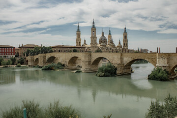 Old historical buildings during summer day in Zaragoza, Spain