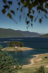 Fototapeta premium Lake with deep blue sky and water in clear summer day with greenery