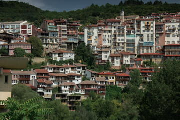 Fototapeta na wymiar City in mountain area with greenery in summer day in Veliko Tarnovo, Bulgaria