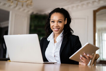 Workplace in coworking. The laptop economist makes a report to the company. The financier works in...