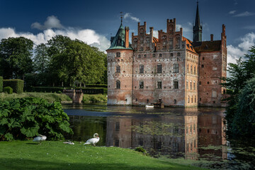 Fototapeta premium Castle estate during summer day in Egeskov Slot, Denmark