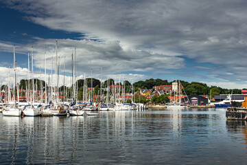 Fototapeta na wymiar Beautiful view of old port town with charming buildings in Svendborg, Denmark