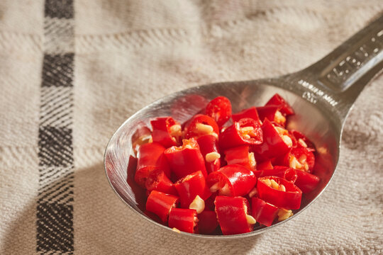 A tablespoon of chopped, fresh, Thai red chili peppers