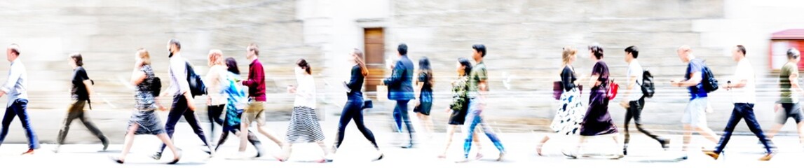 Obraz premium Lots of walking people, multiple exposure illustration represents modern life the big busy city. Business people, young people, students crossing the road