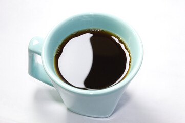 Ocean green coffee cup with white background.