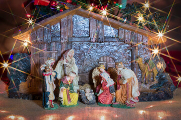 Christmas nativity scene. Hut with baby Jesus in the manger, with Mary, Joseph and the three wise men