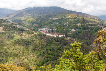 Fototapeta na wymiar View at Trongsa Dzong monastery in the green mountains in Central Bhutan, Bhutan, Asia