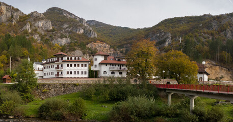 Fototapeta na wymiar Dobrun Monastery on the river Rzav surrounded by mountains in autumn