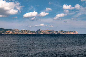 Sailing from boat with coast in horizon during clear day in Spain, Mallorca