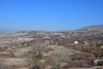 Panoramic views of the mountains and houses on the mountainside. Bright . autumn day in the mountains.