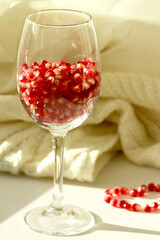 The red ripe juicy pomegranate fruit contains a variety of grains rich in vitamins and health benefits