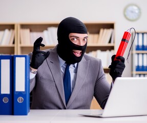 Criminal businessman with balaclava with dynamite