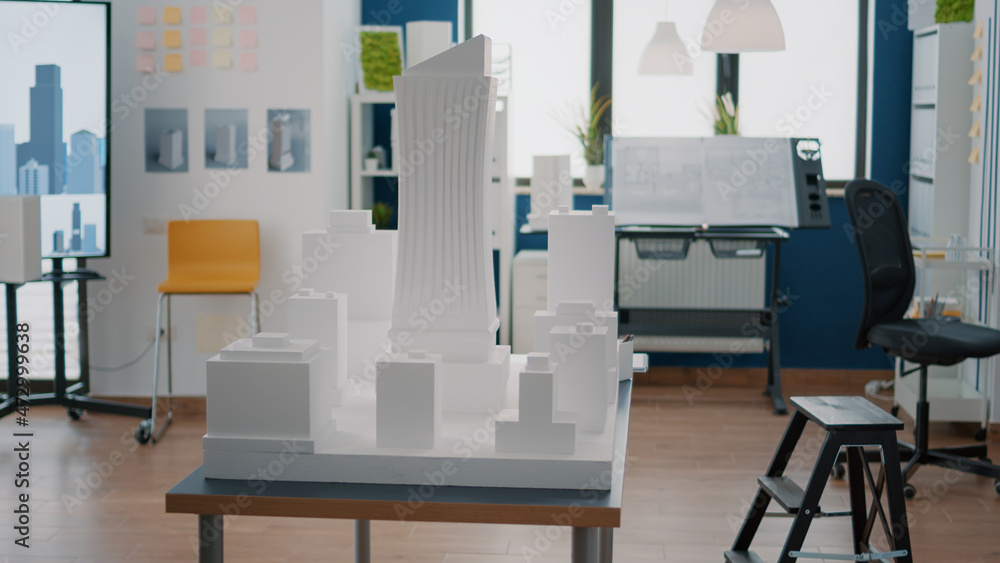 Poster empty architectural space with buidling model and maquette to create property plan on desk. nobody i