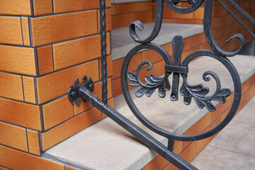 close up of wrought iron railing,element forged on stairs close up