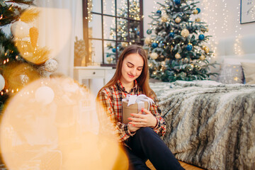 girl with a gift box enjoying winter festive atmosphere